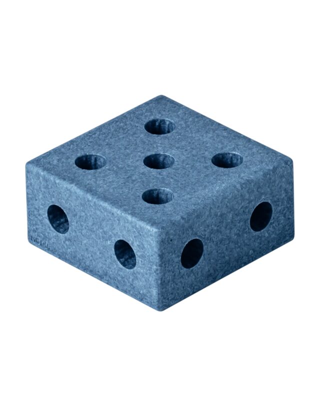 Child playing on MODU square block construction — active indoor play