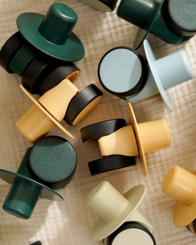 Child building a vehicle with MODU blocks and Swirly Wheels — active play