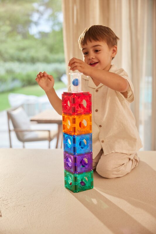 Child building a magnetic ball run with Cleverclixx — creative STEAM educational play